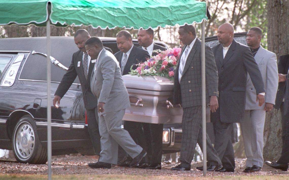 Pallbearers carry the casket of Cherica Adams to the graveside at Sunset Memory Gardens on Dec. 18, 1999, in east Charlotte. More than 1,000 people attended Adams’ funeral.
