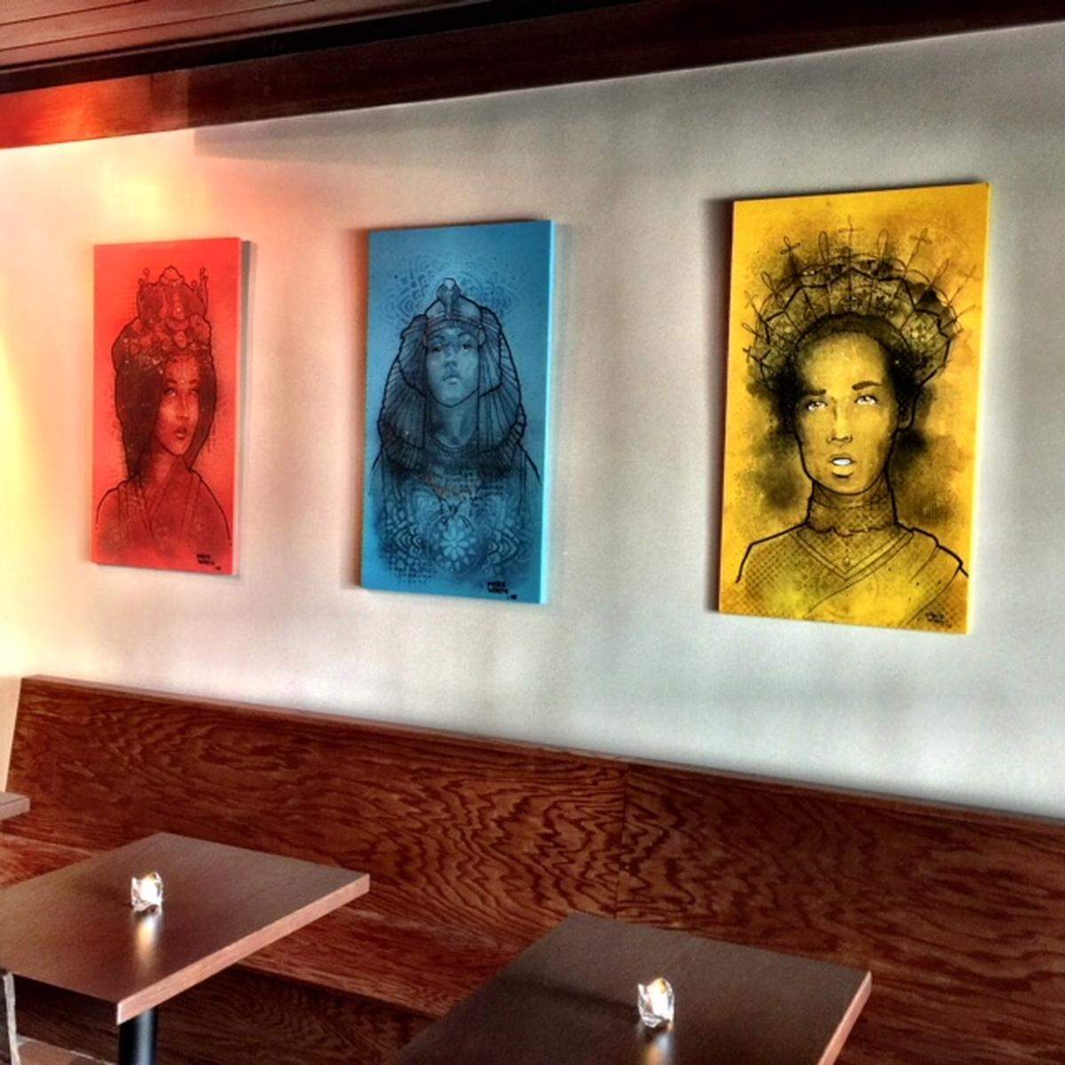 Owner Cory Duran got Mike Wirth, the same artist who did the pop-art in The People's Market, to do portraits of queens for the Queen and Glass.