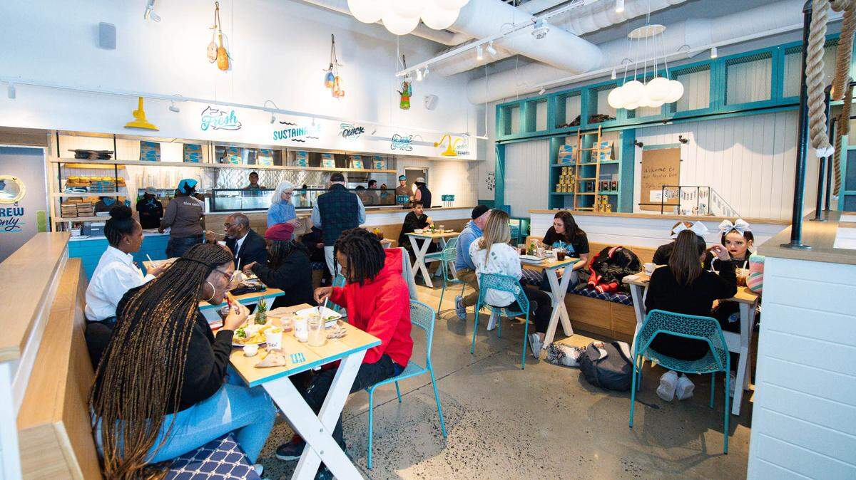 Brown Bag Seafood Co., a Chicago-based fast casual seafood chain, is opening its third and largest location in uptown Charlotte at 601 S. Tryon St. in the Ally Center.