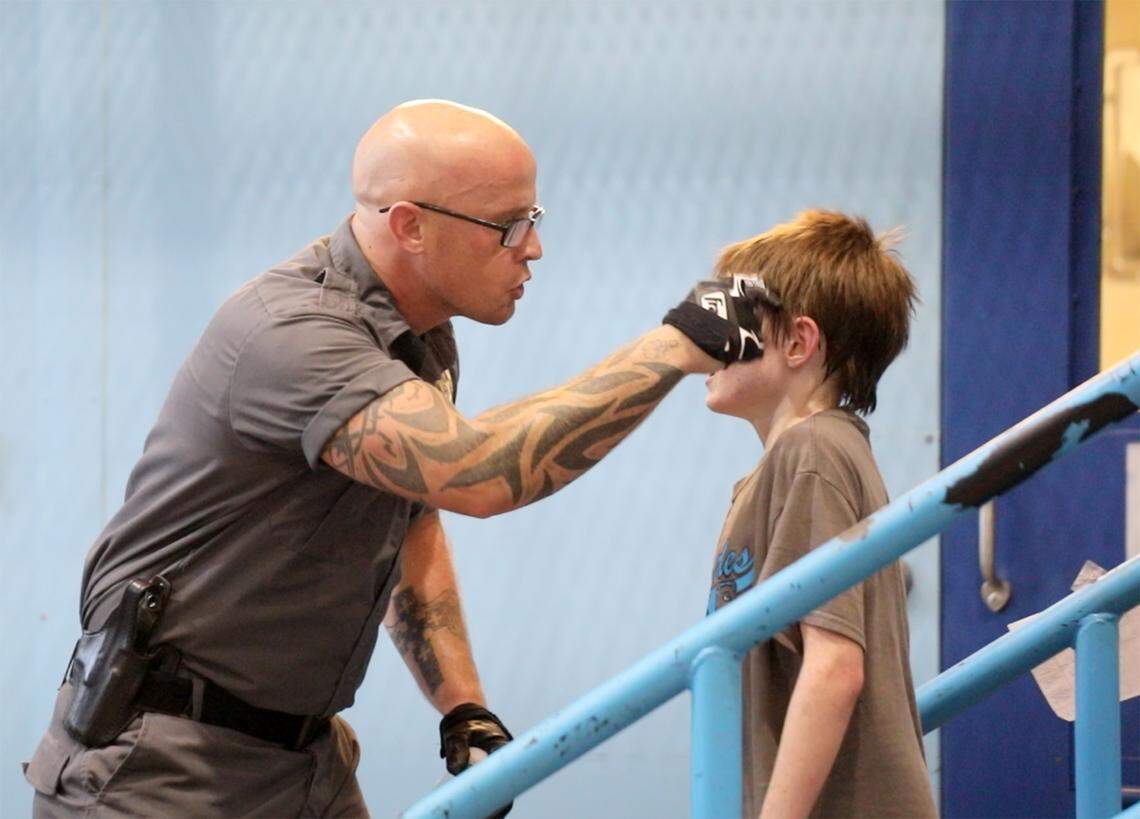 A Chester County Sheriff’s deputy yells instructions to a child during the June, 2018 Project S.T.O.R.M. session.