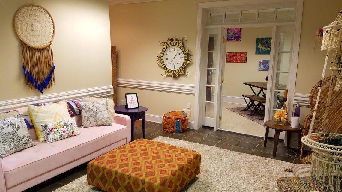 Communal gathering spaces at Queen City Yoga Center create a welcoming sense of home.