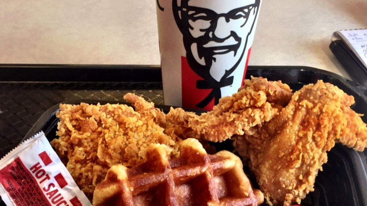 KFC's new chicken and waffle comes with a small, thick, Belgian-style waffle, two pieces of chicken and syrup. Ask for hot sauce on the side for something closer to the real chicken and waffle experience.