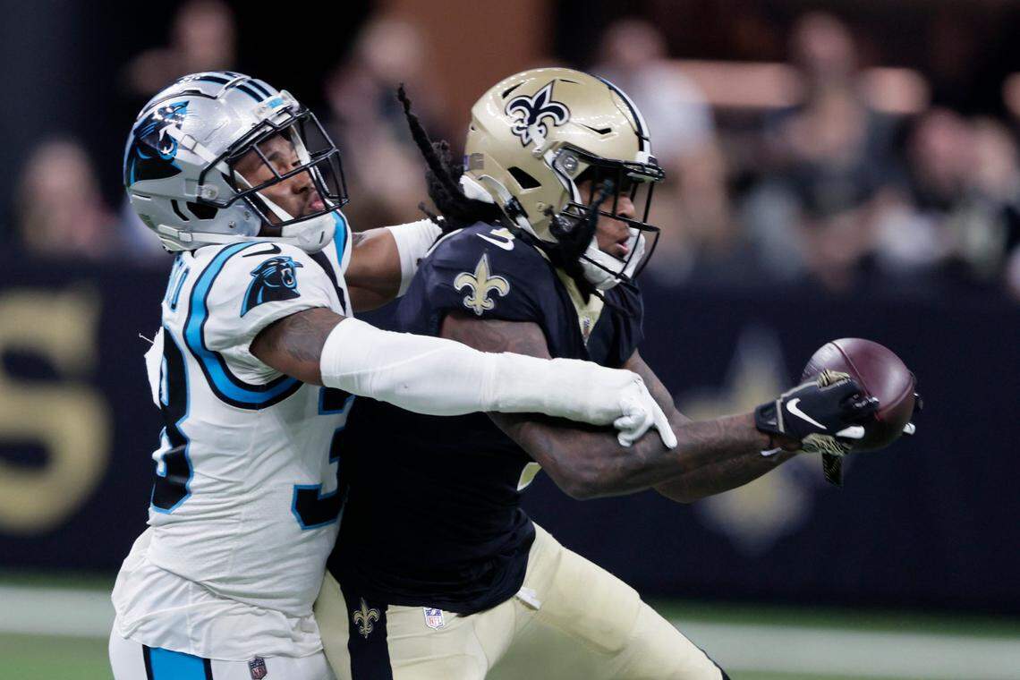 Saints wide receiver Marquez Callaway (1) pulls in a pass against Carolina Panthers defensive back Myles Hartsfield in the first half of Sunday’s game at New Orleans. The Saints won, 18-10, to remain in the NFC playoff hunt.