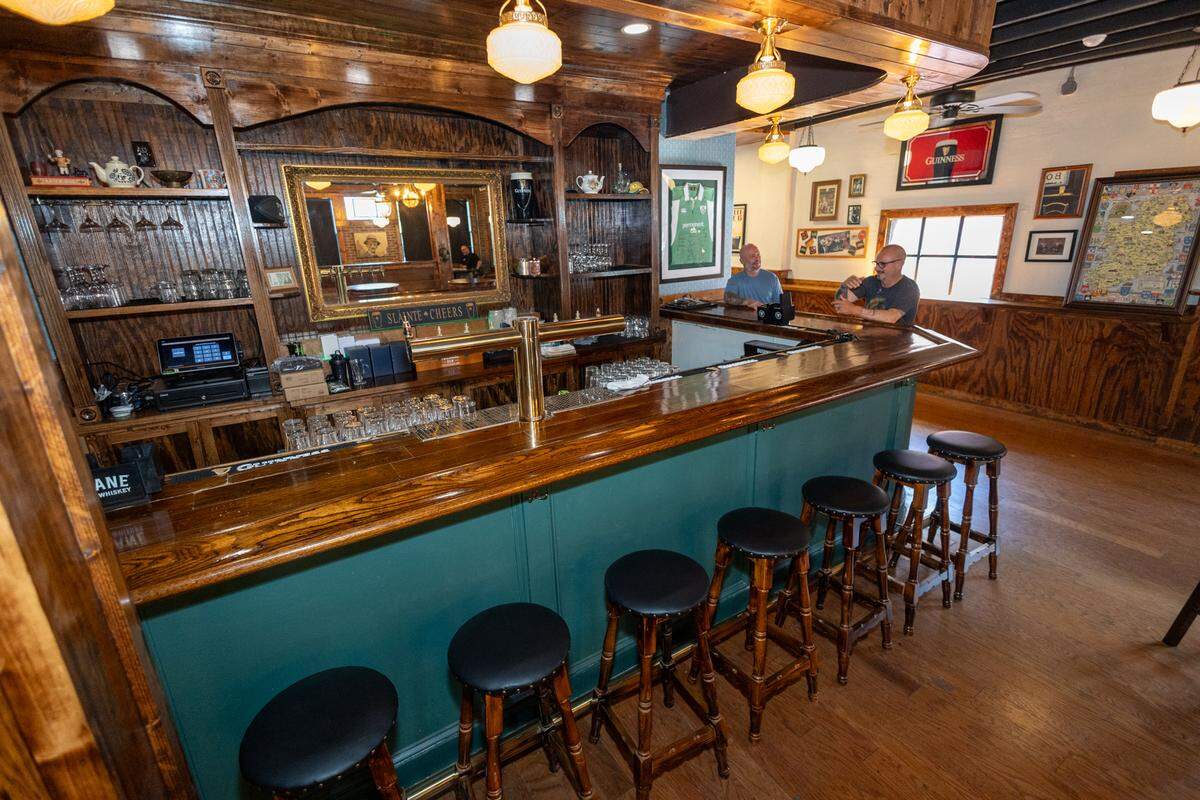 McHale’s owner Brenden Kuhlkin and brother Casey McHale Kuhlkin at the bar.