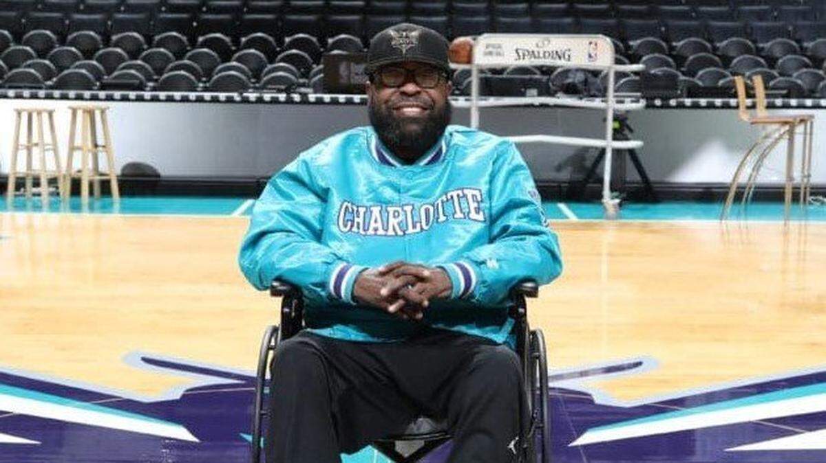 In 2018, Hornets PA announcer Patrick “Big Pat” Doughty posed at center court for a photo.