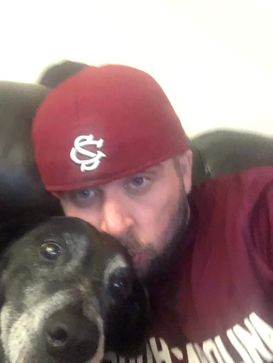 Radio talk show host Travis Hancock with his dog Mabel in an undated photo.