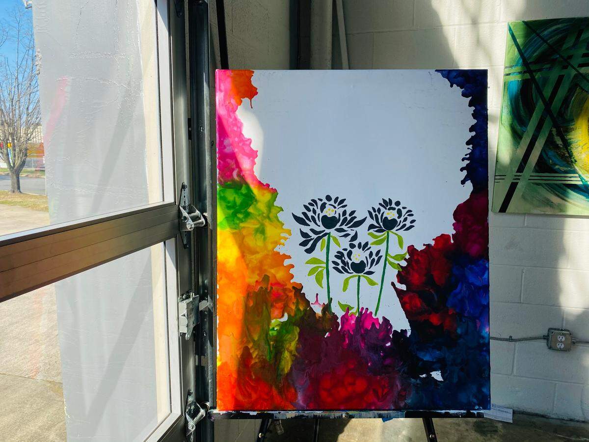 Arelys Ripoll says her art represents her mood at the time. If her mood is dark, she adds a happy or positive element, like the flowers that bloom in “Chaos” (above).