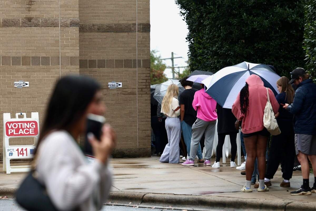 Voters line up at Charlotte Mecklenburg Library at University City to cast their ballot on Tuesday, Nov. 5, 2024.