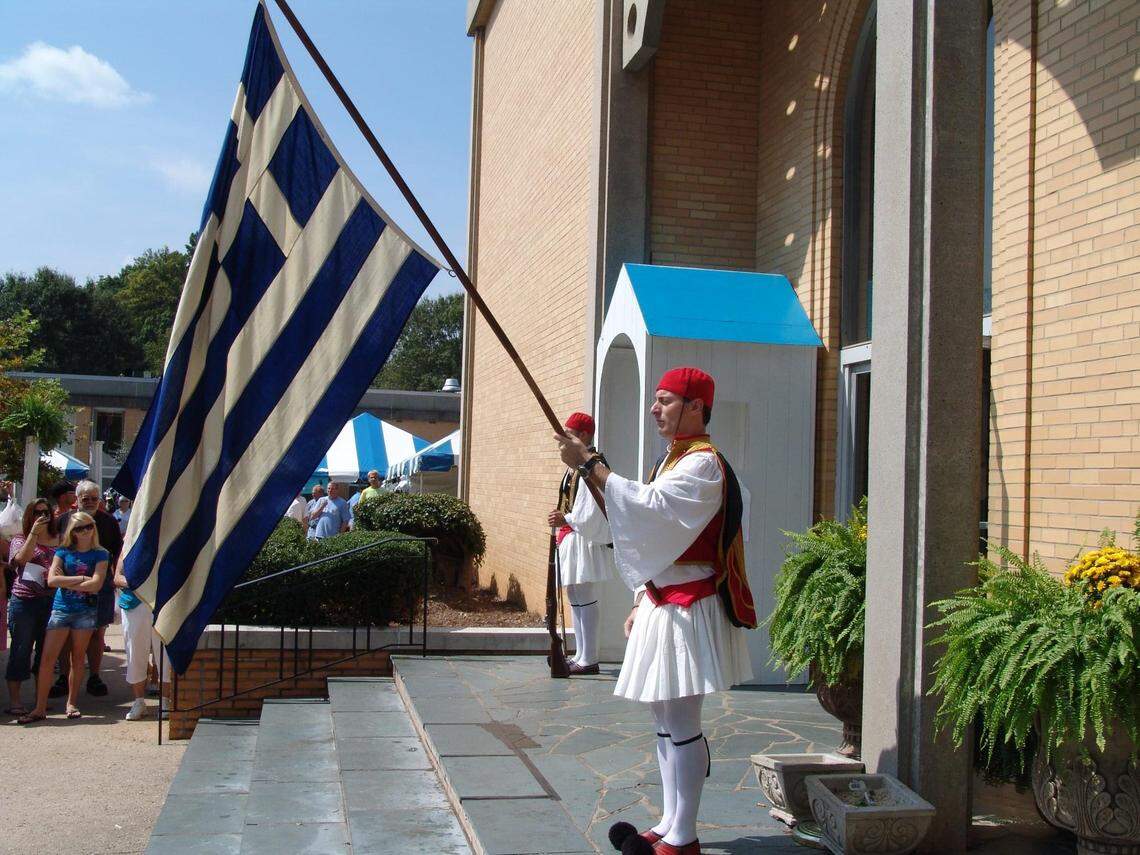 Men from Holy Trinity Greek Orthodox Cathedral dressed in costume at the Yiasou Greek Festival in Charlotte. They are dressed as Evzones (members of the Greek Presidential Guard).