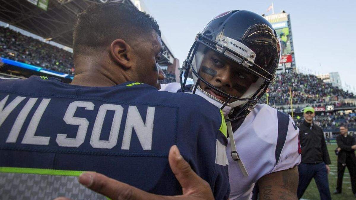 Deshaun Watson, right, won’t be traded to the Carolina Panthers, despite the Panthers’ best efforts to acquire him.