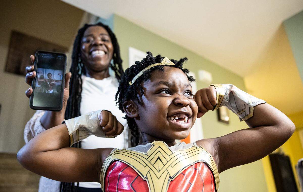 Every February, Riley Johnson, 5, dresses as a different prominent Black woman almost every day to celebrate Black History Month. On Friday, they recreated a photo of news anchor Robin Roberts in a superhero costume.