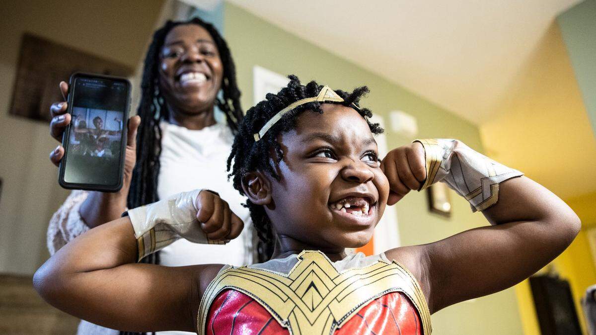 Riley Johnson, 5, front poses for a portrait with her mom Sasha Bonner in Charlotte, NC on Feb. 4, 2022. Riley had been dressing up as Black female figures for the Black History Month.