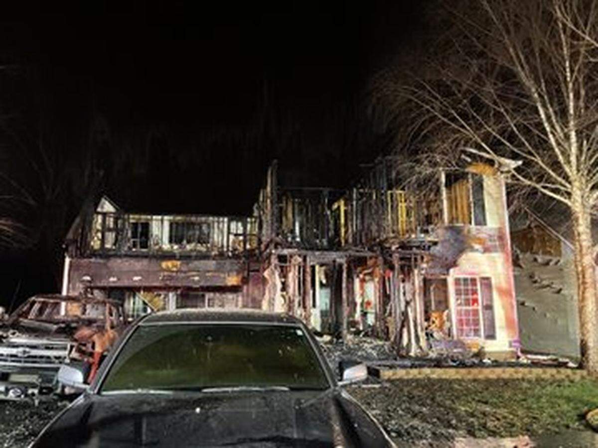 The home and three vehicles in the driveway were a total loss, according to the Huntersville Fire Department.