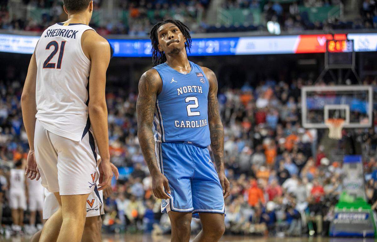 UNC’s Caleb Love (2) shot 3-for-15 against Virginia in a 68-59 loss to Virginia Thursday in the ACC tournament quarterfinals.