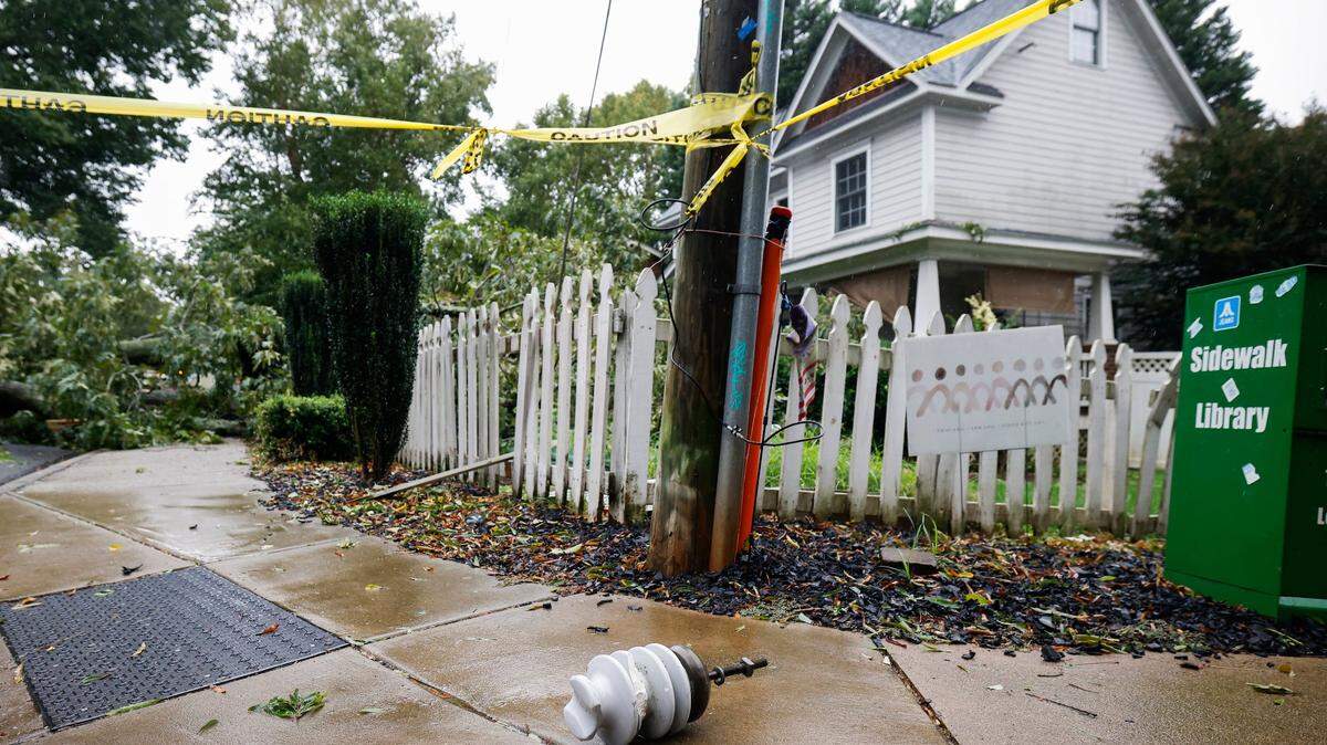 A fallen tree blocks on Holt Street as Hurricane Ian and its remnants begins to arrive in Charlotte, N.C., Friday., Sept. 30, 2022.