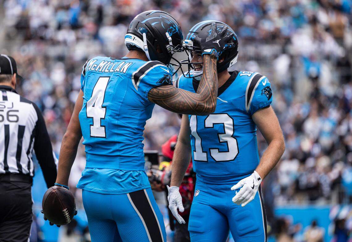 Carolina Panthers wide receiver Tetairoa McMillan, left, celebrates a touchdown with Carolina Panthers wide receiver Hunter Renfrow against the Dallas Cowboys on Oct. 12.
