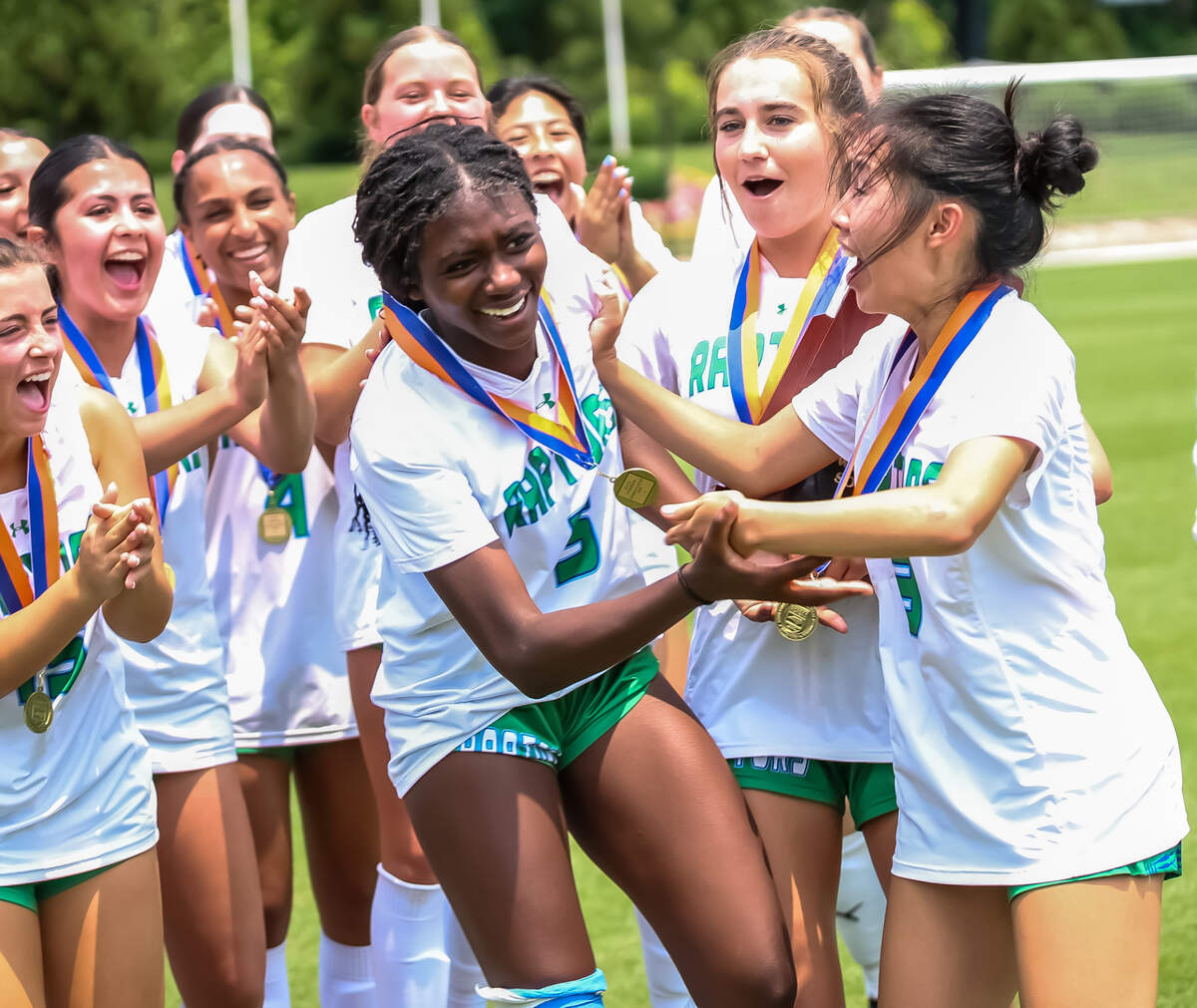 Mountain Island Charter Mia Lor (right) celebrates her teammate Harmoni Carter as she wins MVP at the 1A NCHSAA girls’ soccer state championship at the Matthews Sportplex on May 31st, 2025 in Matthews, NC