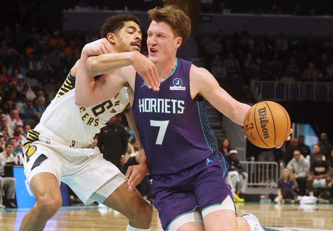 Charlotte Hornets forward Kon Knueppel, right, drives to the basket as Indiana Pacers guard Ben Sheppard reaches across during action at Spectrum Center in Charlotte, N..C on Thursday, January 8, 2026. The Pacers defeated the Hornets 114-112.