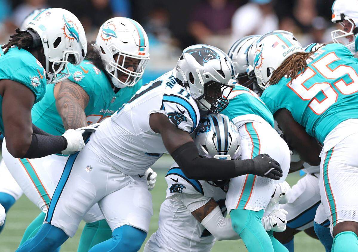 Carolina Panthers linebacker Nic Scourton assists on the tackle of a Miami Dolphins runner during action on Oct. 5, 2025, at Bank of America Stadium. The Panthers defeated the Dolphins 27-24.