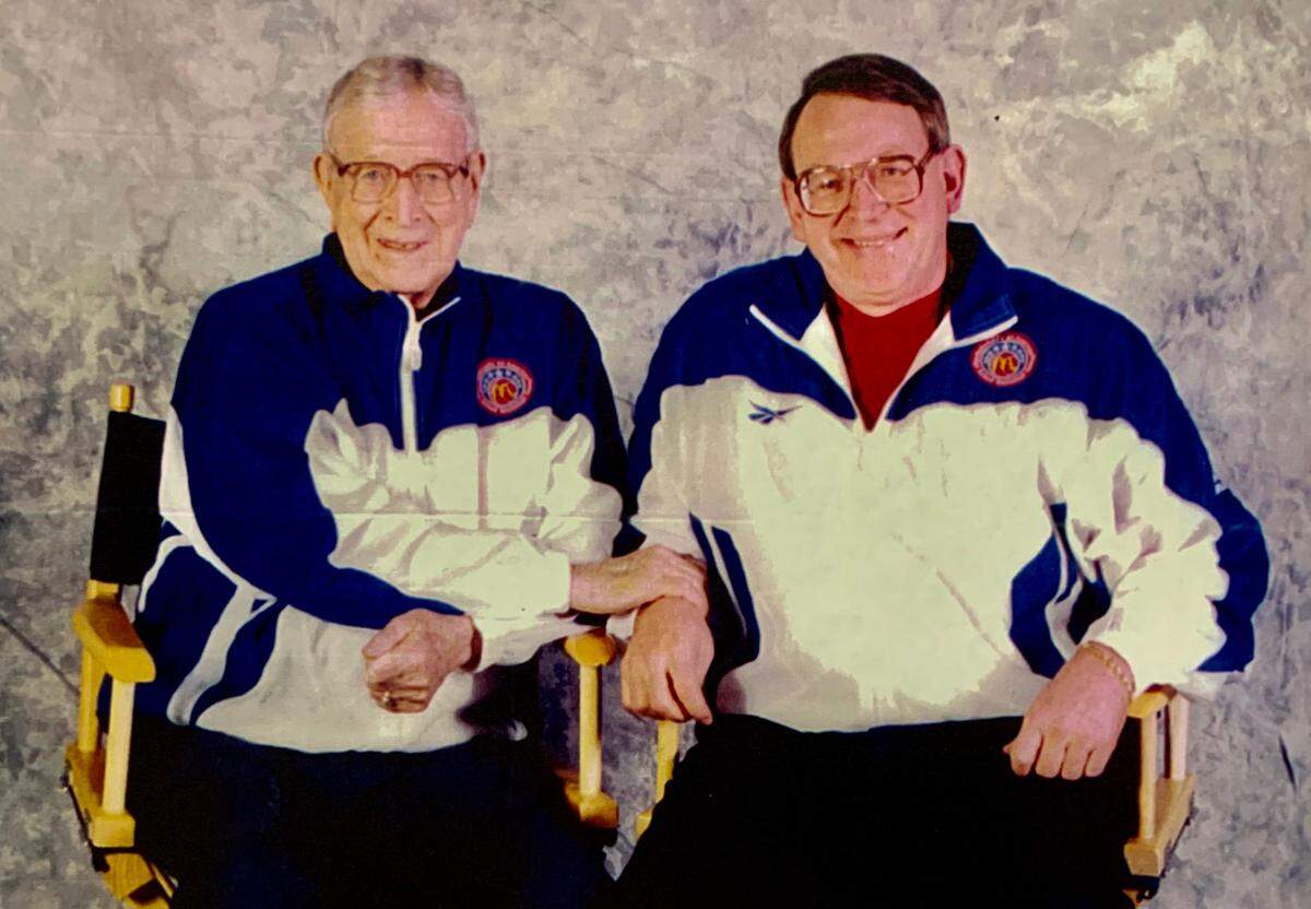 High school recruiting expert Bob Gibbons and legendary UCLA basketball coach John Wooden.