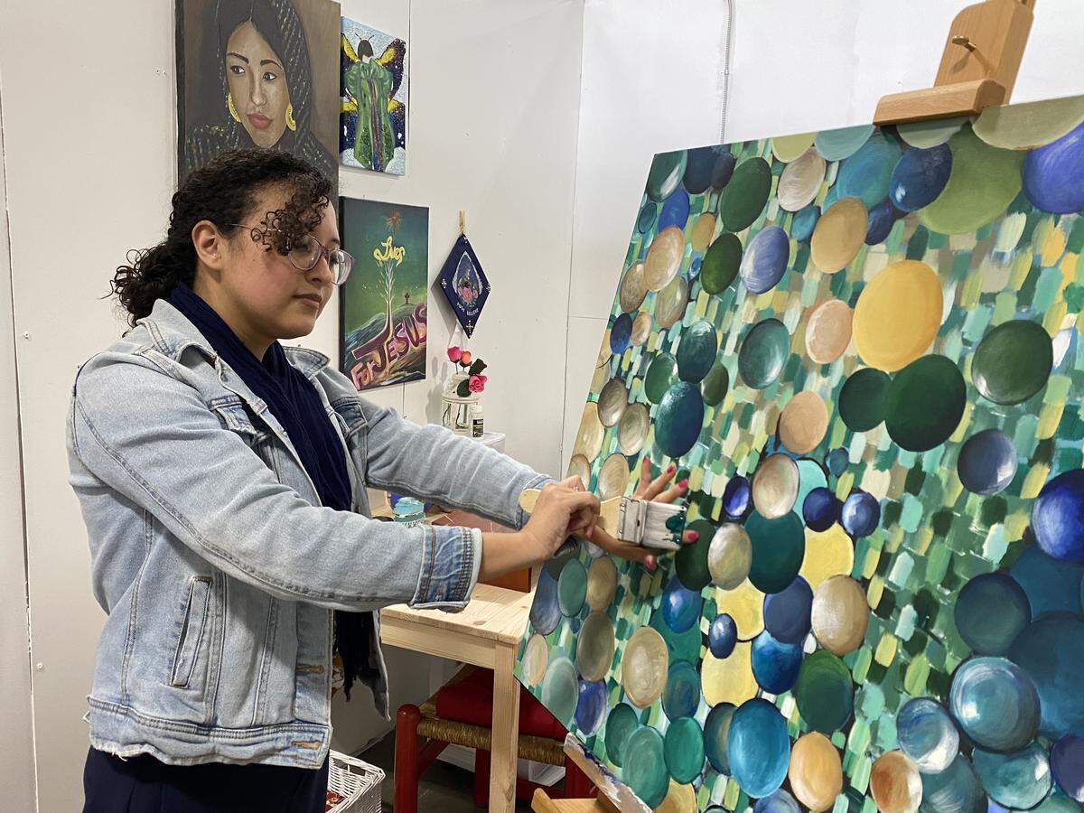 Charlotte artist Rosa Renteria Jimenez paints in her studio at Charlotte Art League. “The inspiration was bubbles. I was thinking about how beautiful and fragile they are. I was really comparing bubbles to people, to me, and how fragile we are, just like bubbles,” Jimenez said.