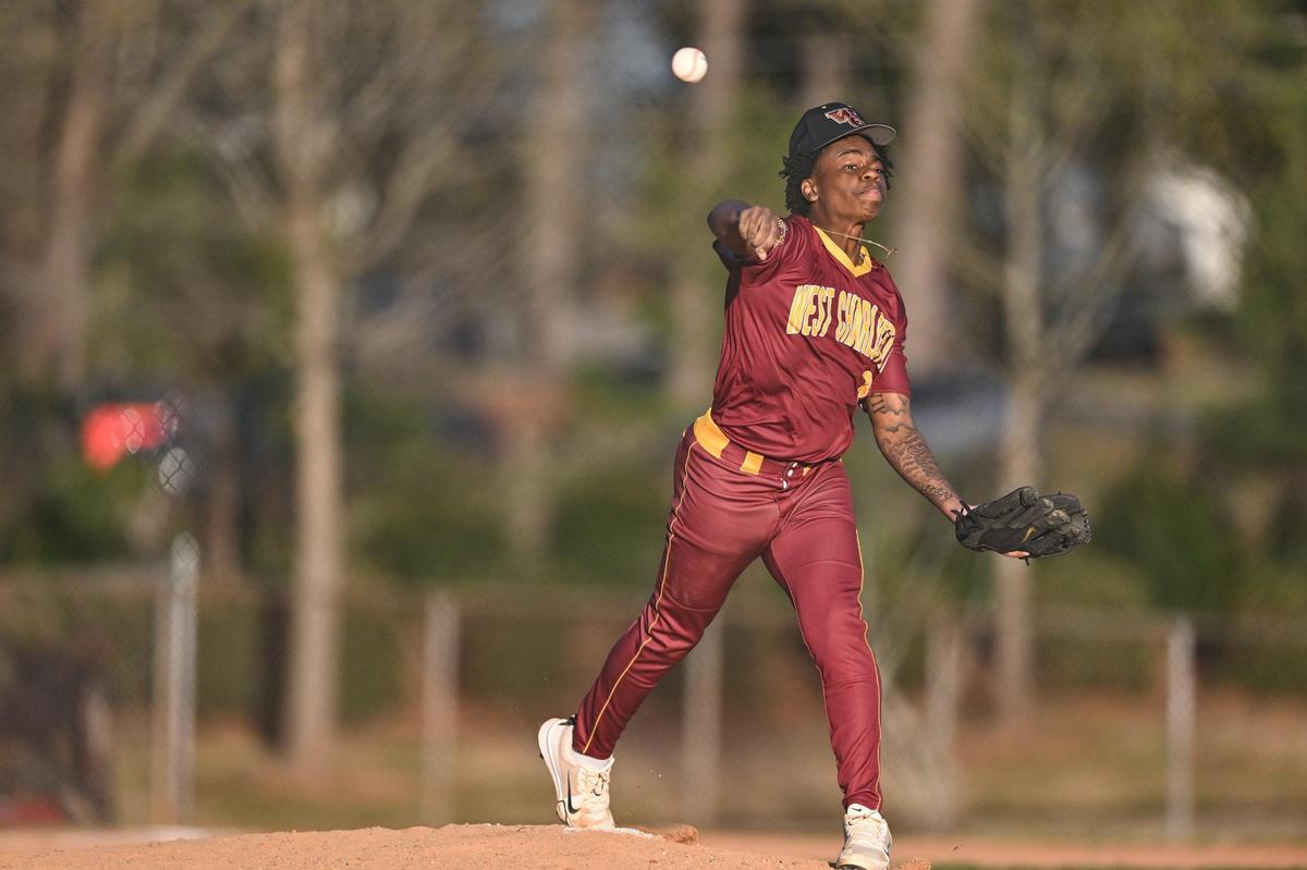 West Charlotte’s Jamell Mason fields a ball during a varsity baseball game against West Mecklenburg, Tuesday, March 18, 2022, in Charlotte, N.C. (Charlotte Observer/Matt Kelley)