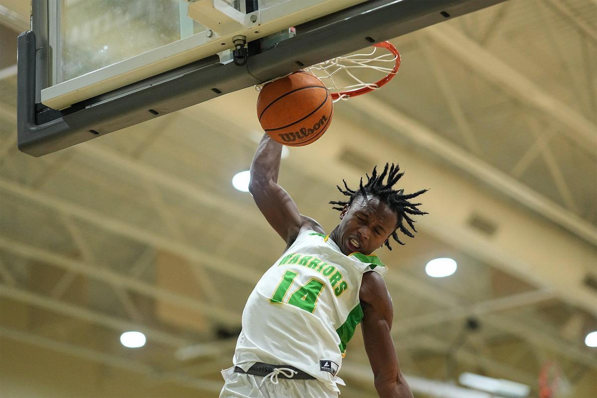 West Iredell’s Jordan Patterson (14) goes up for a slam dunk during the first half of a varsity basketball game against St. Stephens Friday, Dec. 20, 2024, in Statesville, N.C. (Charlotte Observer /Matt Kelley)