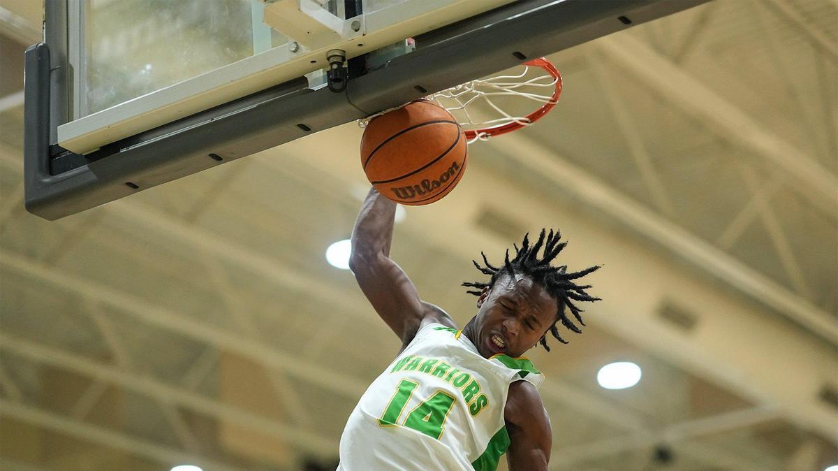 West Iredell’s Jordan Patterson (14) goes up for a slam dunk during the first half of a varsity basketball game against St. Stephens Friday, Dec. 20, 2024, in Statesville, N.C. (Charlotte Observer /Matt Kelley)