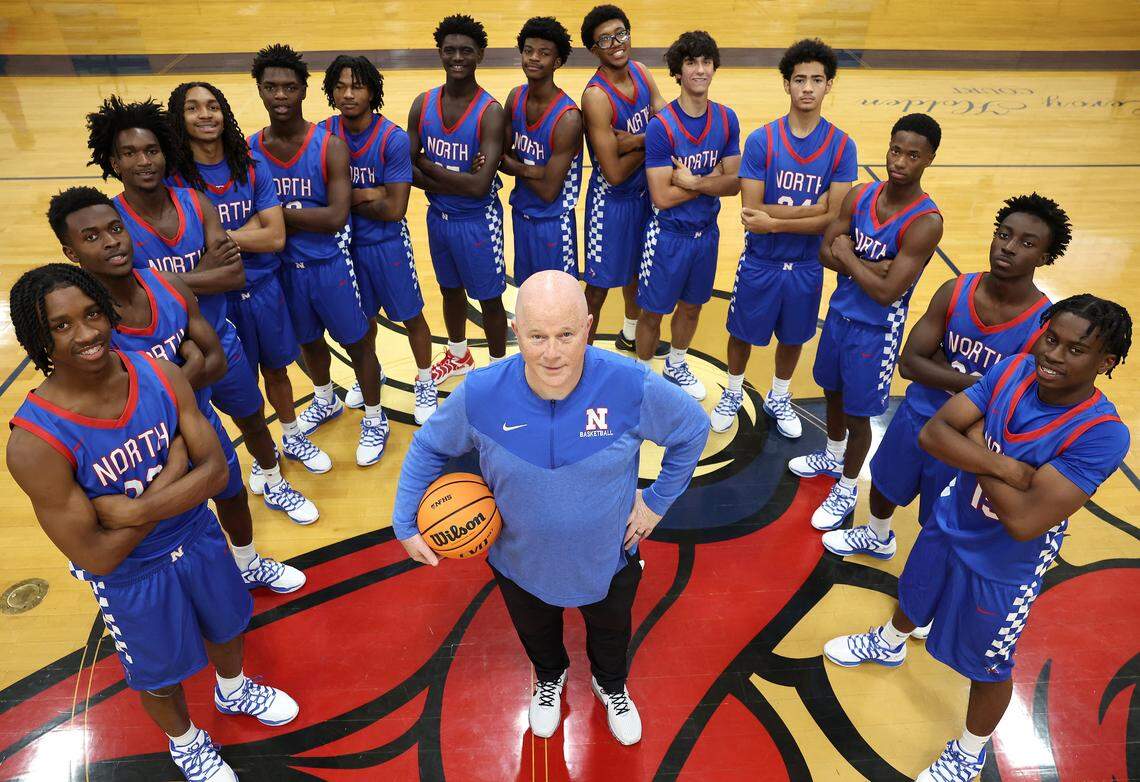 North Meck Vikings head basketball coach Duane Lewis, center and his team on Wednesday, November 5, 2025. During Lewis' career, the boys basketball teams have won four NCHSAA championships. The 2025 North Meck boys basketball team is ranked No.1 in the preseason sweet 16.
