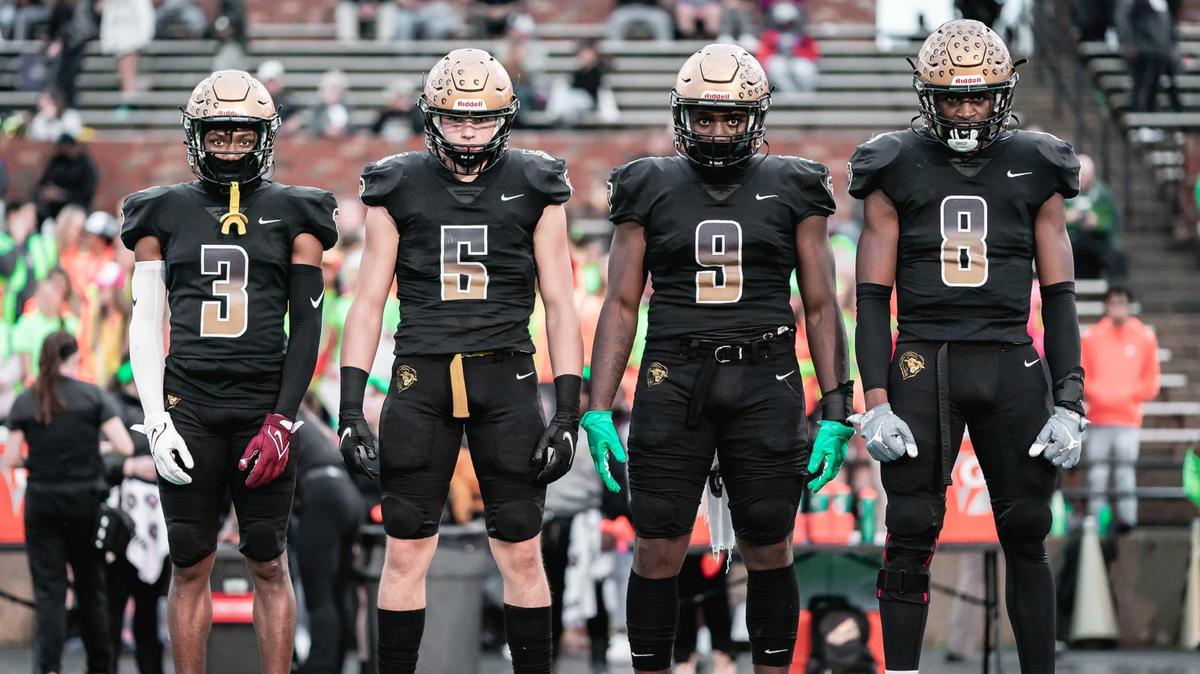 The Shelby High School football team has won six North Carolina state titles in the past eight years. The Golden Lions will go for number seven on Saturday. From left to right: Marquis Adams (3), Sam Baldree (5), Santana Hopper (9) and Malaki Hamrick (8).