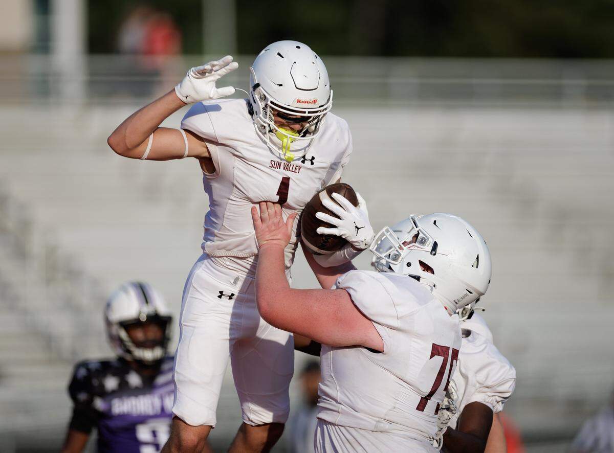 Sun Valley players celebrate a touchdown during their scrimmage vs. Ardrey Kell. 
