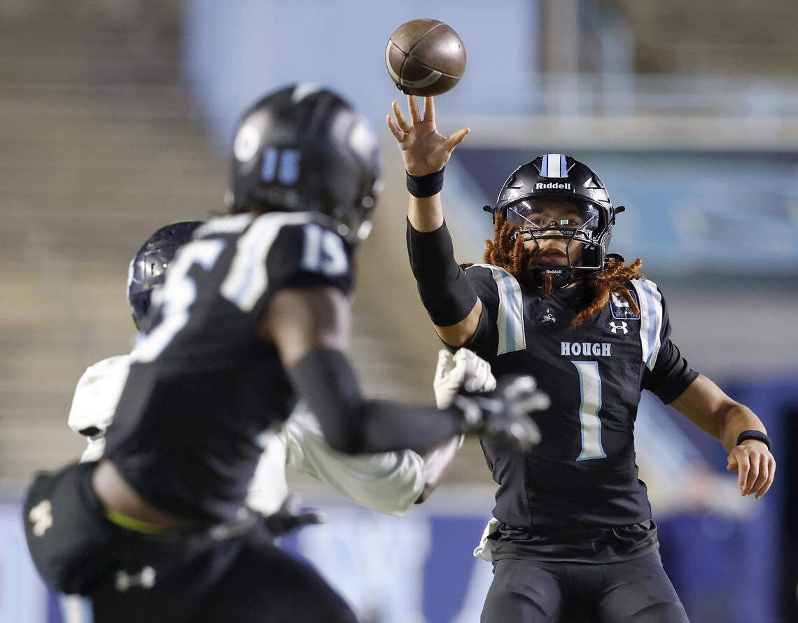 Hough quarterback Ethan Royal looks to pass during the second half of the Huskies’ 21-0 win over Millbrook in the NCHSAA 8A high school football state final on Thursday, Dec. 11, 2025, at Kenan Stadium in Chapel Hill, North Carolina.