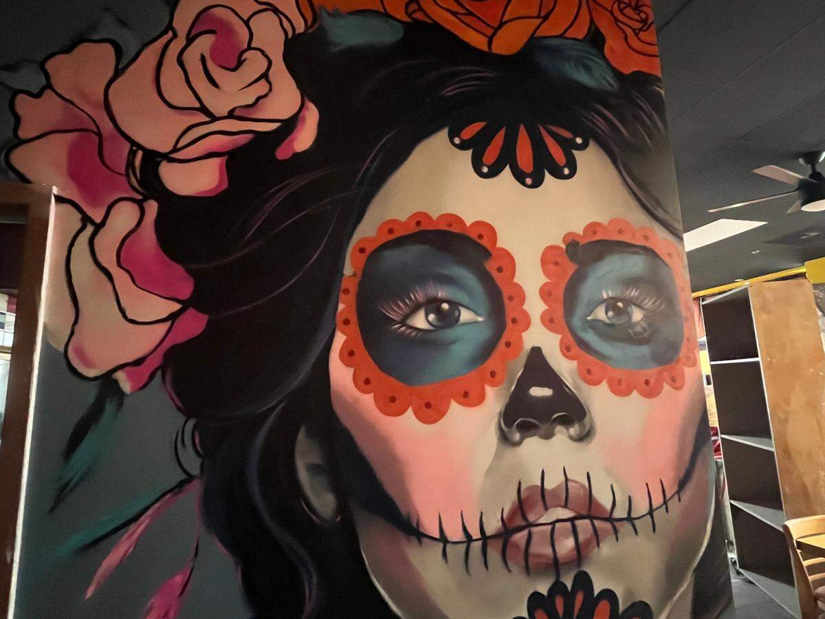 A calavera mural by Alex DeLarge decorates the hallway at Mr. Reyo Mexican Grill in Fort Mill.
