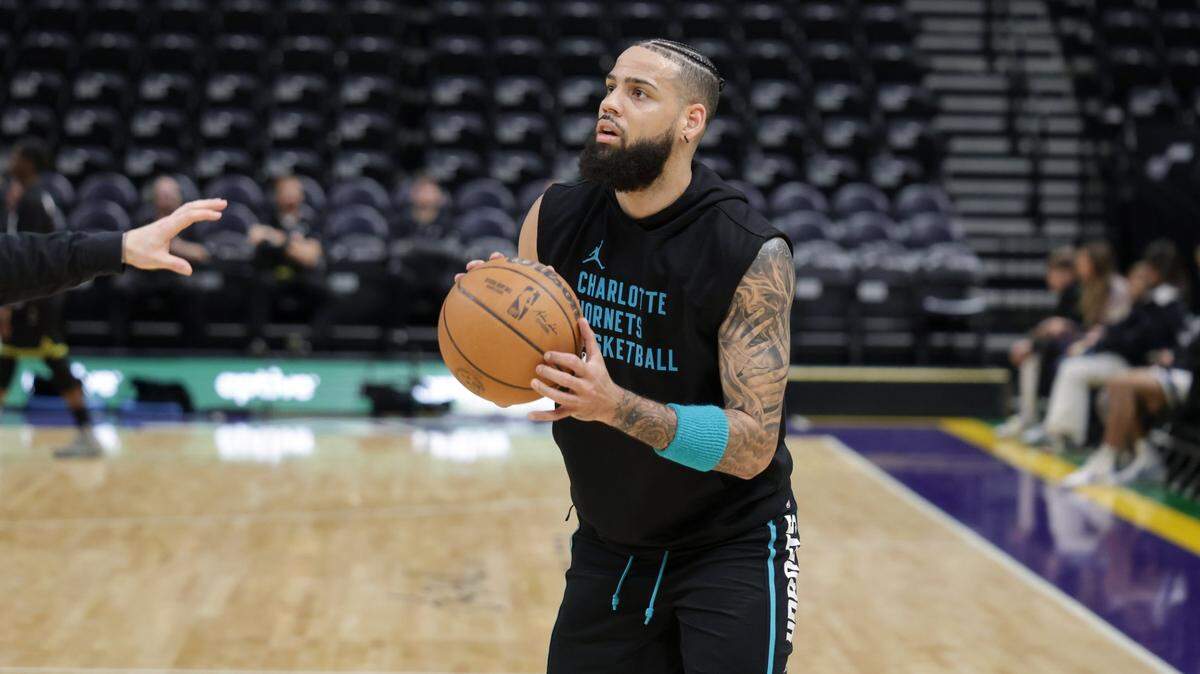 Charlotte Hornets forward Cody Martin (11) warms up before the game against the Utah Jazz at Delta Center.
