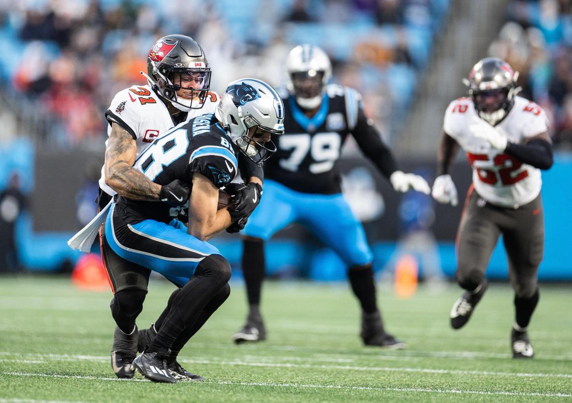 Carolina Panthers wide receiver Dan Chisena, front, is tackled by Tampa Bay Buccaneers safety Antoine Winfield Jr. at the Bank of America Stadium in Charlotte, N.C., on Sunday, December 1, 2024.