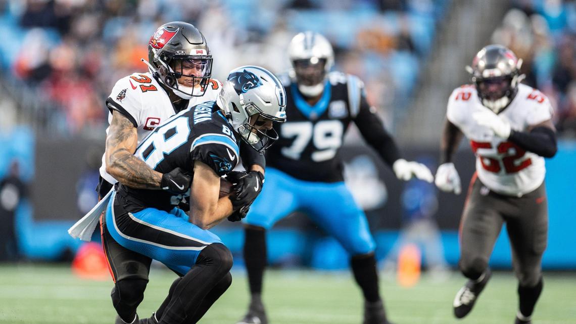 Carolina Panthers wide receiver Dan Chisena, front, is tackled by Tampa Bay Buccaneers safety Antoine Winfield Jr. at the Bank of America Stadium in Charlotte, N.C., on Sunday, December 1, 2024.