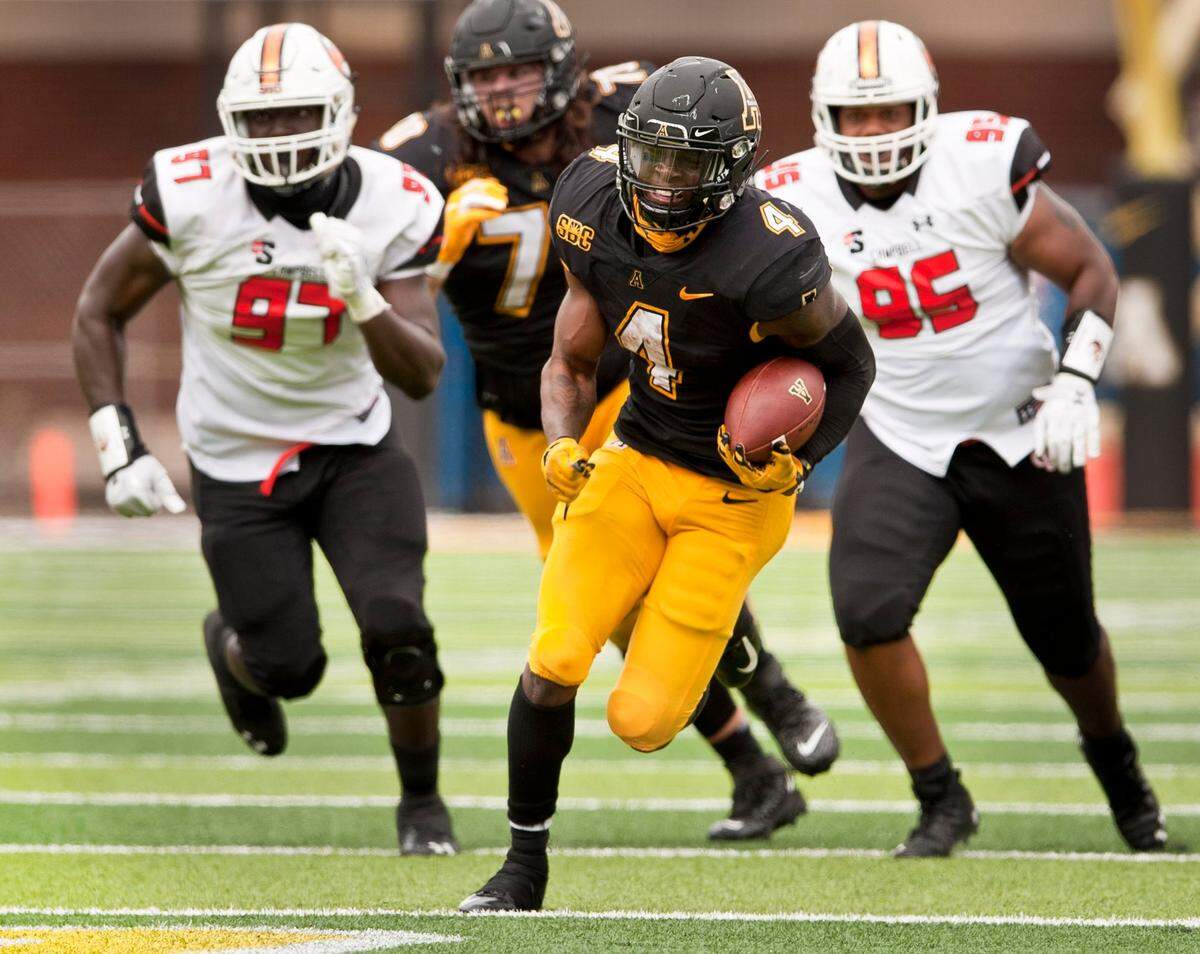 Appalachian State running back Daetrich Harrington finds a hole in the Campbell defense to break loose for a 40 yard touchdown run during the second half an NCAA college football game, Saturday, Sept. 26, 2020 at Kidd Brewer Stadium in Boone, N.C.
