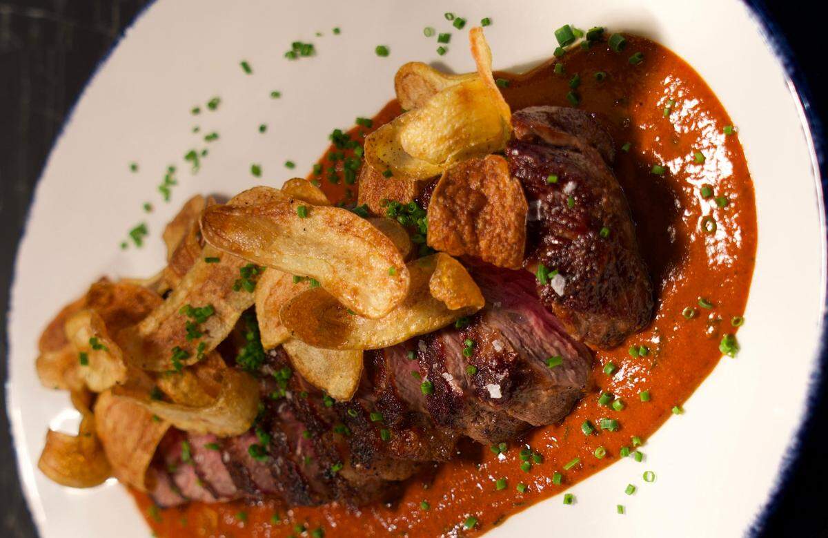 Henrietta’s ribeye with Piquillo salsa and crispy fingerlings.