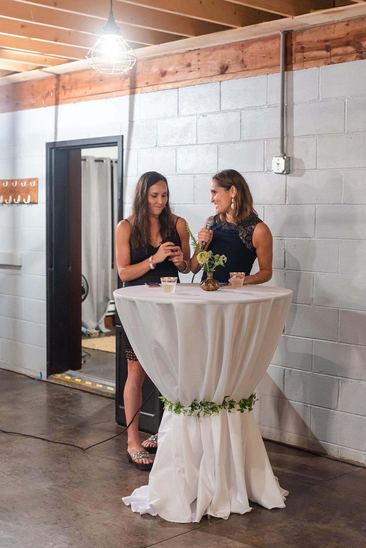 Kelly Fillnow, left, with Meghan Fillnow, photographed giving a toast at their friends’ wedding in Banner Elk in 2021.
