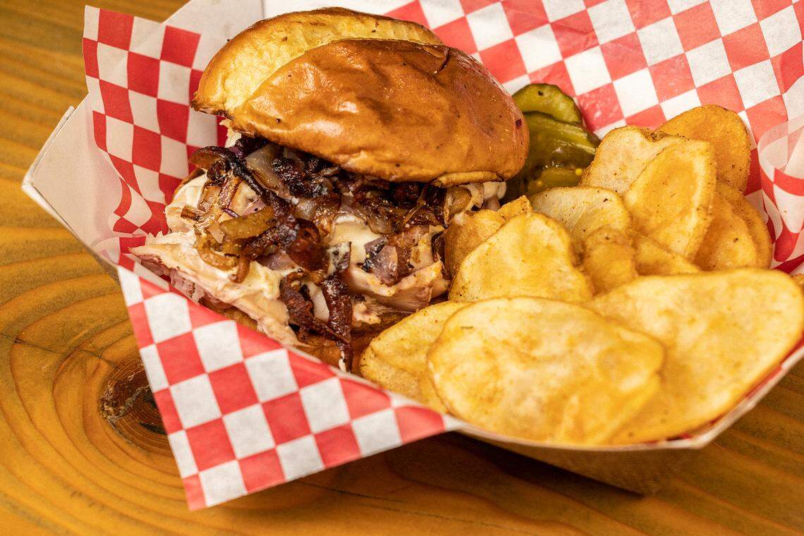 Firehawk Brewpub’s chopped chicken sandwich. Firehawk Brewpub served in-house brewed beer and North Carolina wood-fired barbecue. The restaurant has closed.