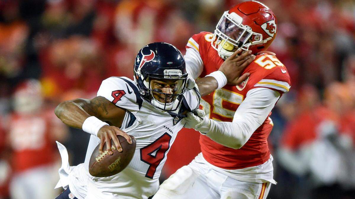 Houston Texans quarterback Deshaun Watson (4) was sacked by Kansas City Chiefs defensive end Frank Clark (55) during fourth quarter of the AFC Divisional playoff Sunday at Arrowhead Stadium in Kansas City.