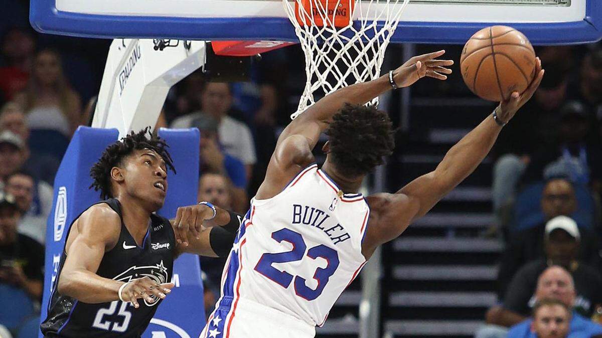 Wes Iwundu (25), pictured here guarding Jimmy Butler in 2018, is joining the Hornets as part of a sign-and-trade.