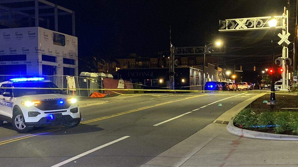 A Charlotte-Mecklenburg Police closed North Davidson Street after an officer was shot in the leg on Tuesday, June 28, 2022.