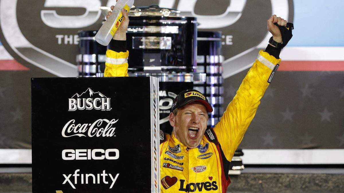 DAYTONA BEACH, FLORIDA - FEBRUARY 14: Michael McDowell, driver of the #34 Love’s Travel Stops Ford, celebrates in victory lane after winning the NASCAR Cup Series 63rd Annual Daytona 500 at Daytona International Speedway on February 14, 2021 in Daytona Beach, Florida. (Photo by Chris Graythen/Getty Images)