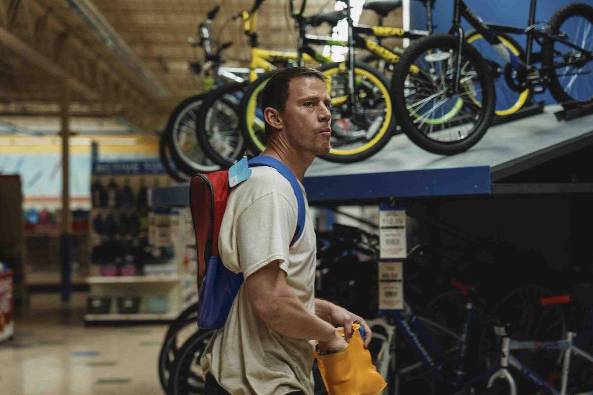 Channing Tatum as Jeffrey Manchester in “Roofman,” much of which is set in the busy Toys R Us store he’s hiding in.