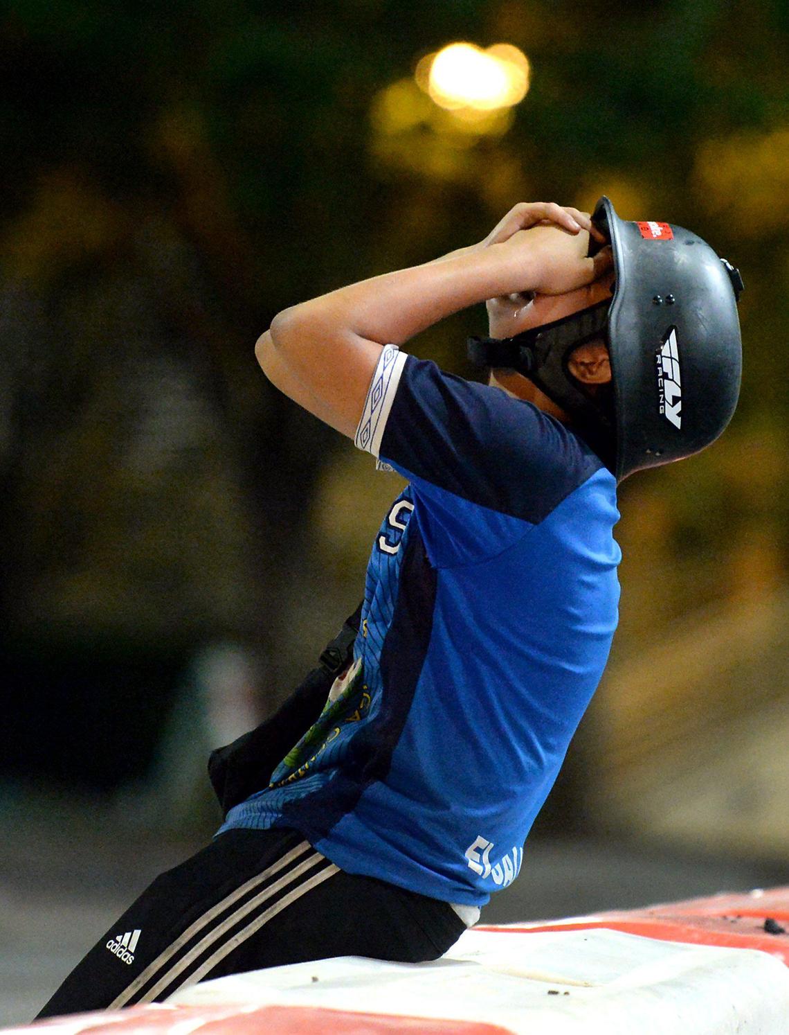 A young protester experiences the effects of pepper balls, flash bangs and tear gas used by CMPD on 4th Street in Charlotte, NC on Tuesday, June 2, 2020.