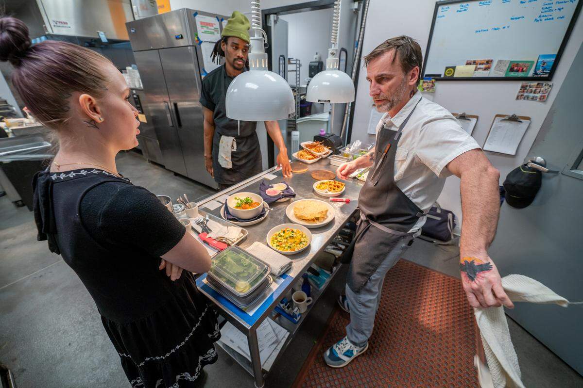 Chef Sam Diminich talks to staff at his Charlotte restaurant, Restaurant Constance. He told CharlotteFive there was never a question about whether he would work in restaurants. “I’ve had a straight line — born in a restaurant, lived in a restaurant all my life.”