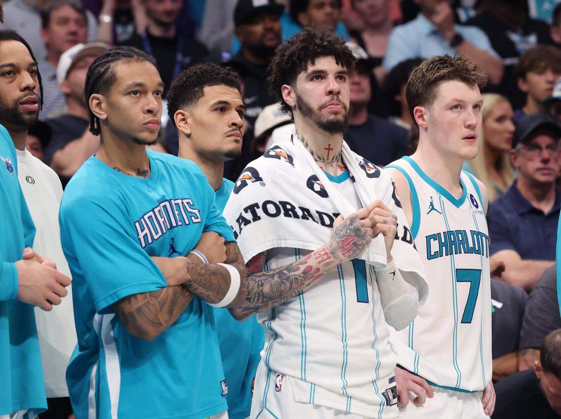 Charlotte Hornets guard LaMelo Ball, center, stands along the team's bench with his teammates during action against the Miami Heat at Spectrum Center in Charlotte, NC on Tuesday, April 14, 2026. The Hornets defeated the Heat 127-126 in NBA Play-in-Tournament basketball game.