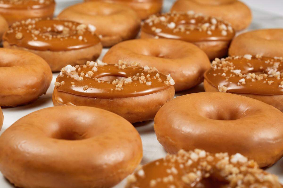 Krispy Kreme’s Caramel Glazed Doughnut is the classic Original Glazed Doughnut covered in rich caramel glaze and its Salted Double Caramel Crunch Doughnut is the Caramel Glazed Doughnut dipped in rich caramel icing, and sprinkled with salted crunch topping.