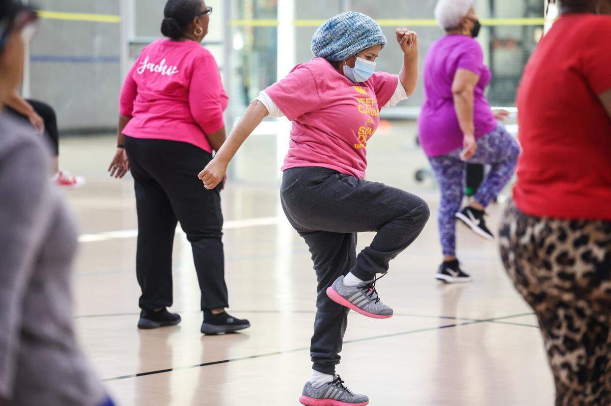 Ana Burne, center, dances enthusiastically during the Valentines Day Line Dance Social for seniors at Castaway Regional Recreation Center on Tuesday, February 14, 2023.